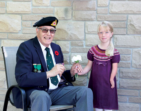 Charlie Jefferson, a Second World War amputee veteran and Isla McCallum, a member of The War Amps Child Amputee (CHAMP) Program.