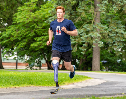 Gabriel, a leg amputee, running.